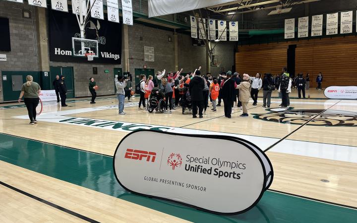 A group of students share a team huddle after finishing a drill at the Special Olympics event in Cleveland State University's Woodling Gymnasium, Feb. 5, 2025.