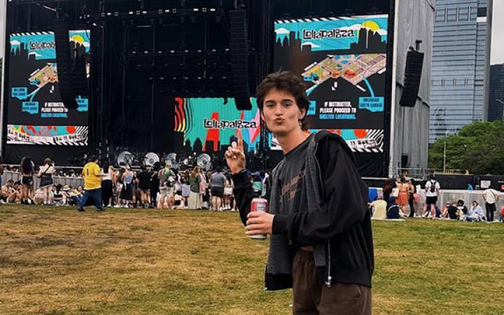 Evan Peters poses at the Bud Light stage waiting for Lana Del Rey to begin her set.