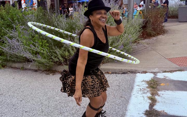 Woman hoola hoops at Waterloo Arts Fest