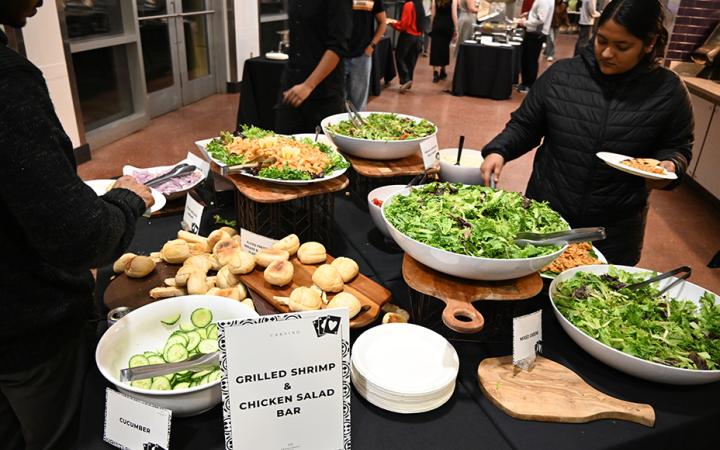 CSU student tries the grilled shrimp and chicken salad bar. (credit: Alex Martinez)