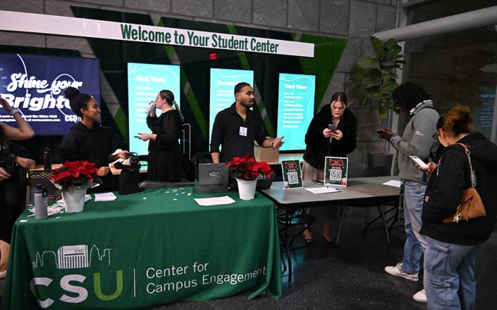 The Center for Campus Engagement helping CSU students and guests sign in for the event.  (credit: Alex Martinez)