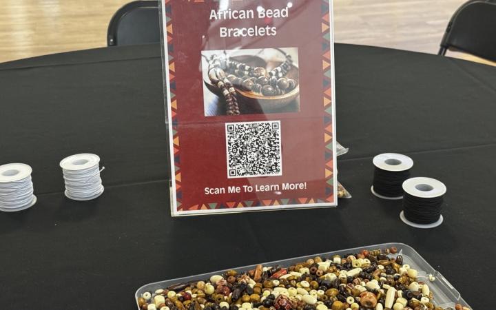 African Bead Bracelet table with a QR code that leads to more information about its cultural importance, Nov. 4, 2025. (credit: Anthony Reed)