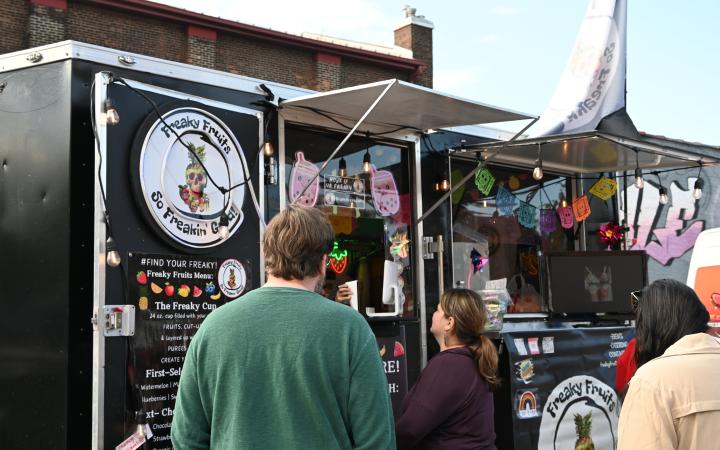 Attendees wait for their orders at the Freaky Fruits food truck, Nov. 1, 2025. (credit: Alex Martinez)