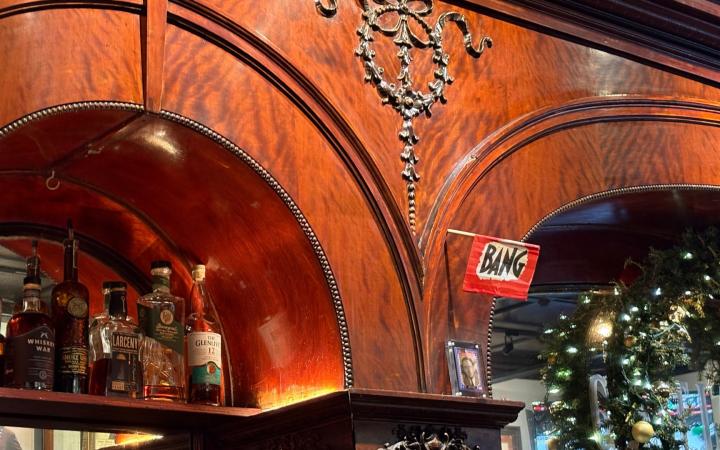 "Bang" marks a bullet hole from an unknown incident in the historic 1901 bar. (credit: Morgan Alten)