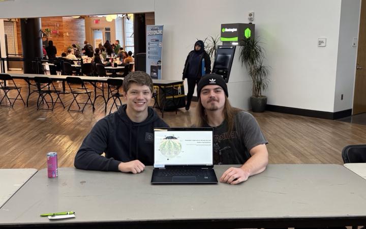 Seth Patterson, left, and Tyler Roeper with their presentation on pesticides in agriculture. (credit: Anthony Reed)