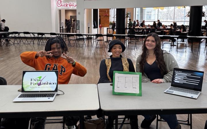 Leo Cahill Jr., left, Tay Horne, middle, and Grace Weske with their presentation on how low-quality synthetic clothes harm Earth. (credit: Anthony Reed)