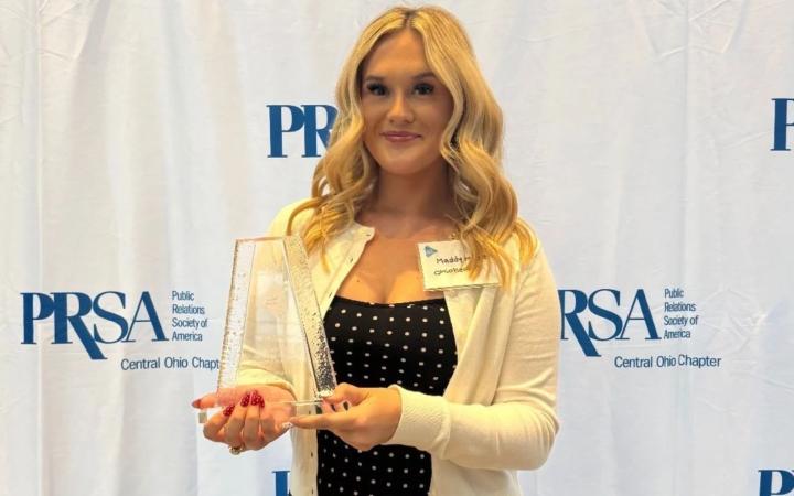 Credit: Madison Medlen Caption: Madison Medlen accepting an award for best use of audio in her OhioHealth podcast at the PRSA PRism awards on May 21, 2026.