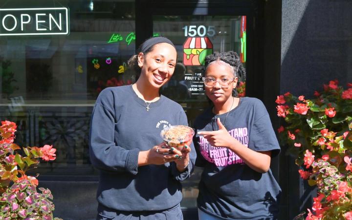 Manager Madison Johnson, left, and employee Erica McPherson outside The Fruit Stand.