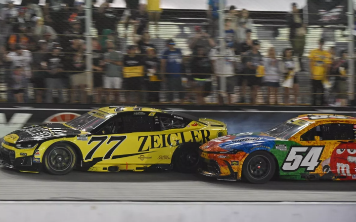 Hocevar (77) and Gibbs (54) make contact while battling for the lead at Bristol Motor Speedway.