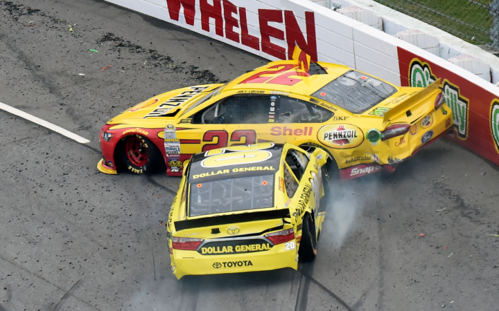 Kenseth (20) wrecks Logano (22) at Martinsville Speedway on Nov. 1, 2015.