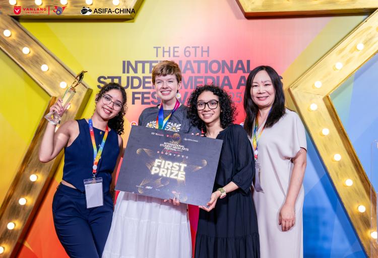 Naliyah Dejesus, left, Kara Nottingham, 2nd left, and Julia Whitaker, 2nd right, with Qian Li, professor in the CSU Department of Art and Design, with their 1st prize award at the International Student Media and Arts Festival, Ho Chi Minh City, Vietnam, July 24-30, 2025.