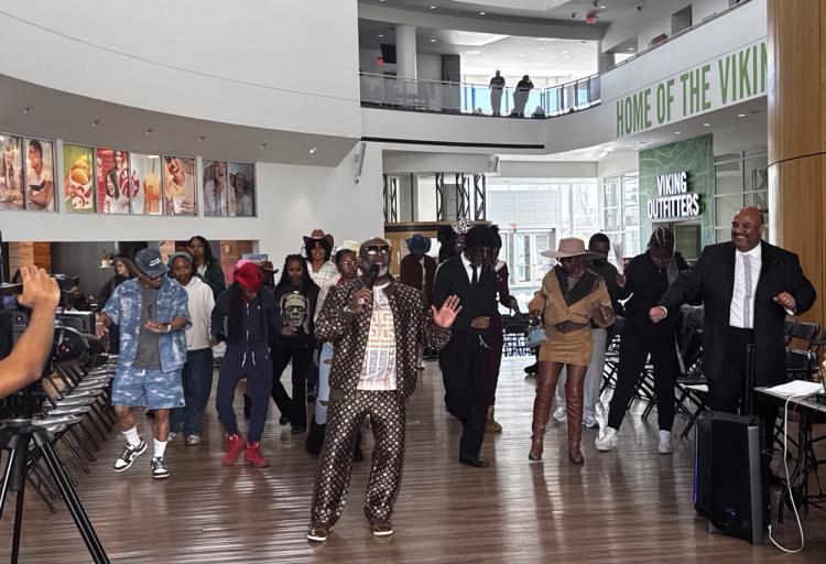 DJ Robert Johnson leading the line dance to “Boots on the Ground/Where Them Fans At?” at the end of the fashion show, Nov. 6, 2025. (credit: Anthony Reed)