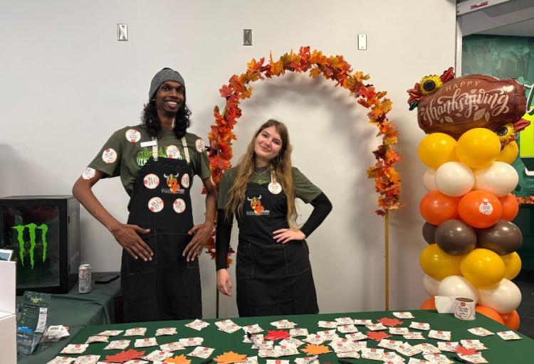 Student volunteers at the entrance of Vikesgiving, handing out “Thankful For You” stickers, Nov. 20, 2025. (credit: Morgan Alten)