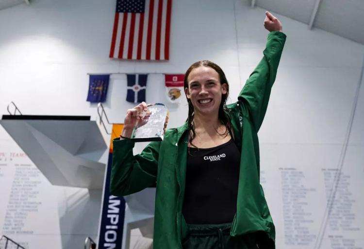 Ellie Seiter holds her 1-meter diving championship award at the Horizon League Championship on Feb. 20, 2026.