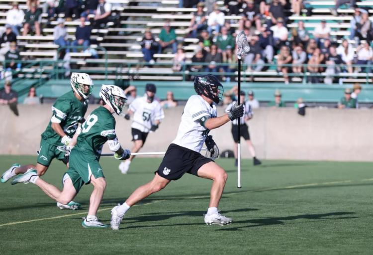 Adam Van Voorhis carries the ball upfield against LIU during Cleveland State’s regular-season finale in Brookville, N.Y.
