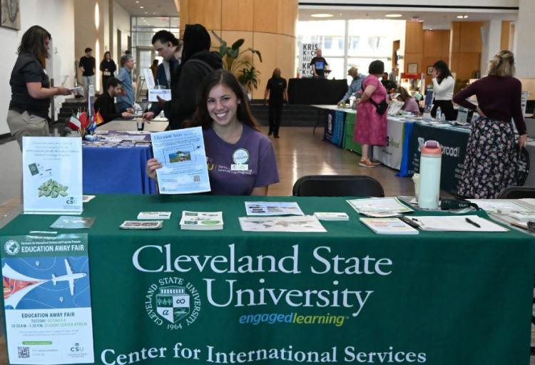 Ruthie Sasso, Education Away graduate assistant, at the fair welcome table on Oct. 6, 2026.