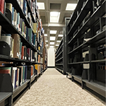 Michael Schwartz library stacks with damaged books