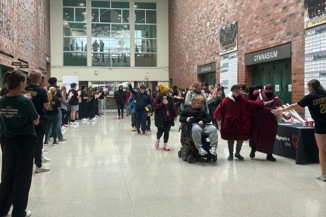 The event welcomed students from eight schools with a high-energy tunnel entrance, as volunteers cheered and encouraged athletes as they entered the gym. (credit: Aria Ruiz) 