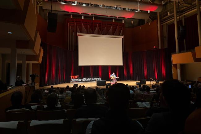 Charlie Mosbrook playing the guitar, performing one of his own songs at TEDx Cleveland State University on October 23, 2026. (Credit: Aria Ruiz)