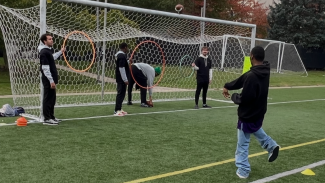 An athlete shows off his football skills by throwing to the target at the Special Olympics, Oct. 7. (Credit: Tony Pisaneschi)