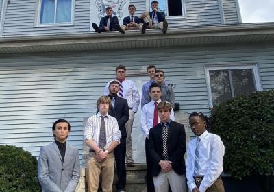 In the foreground: New associate members at the fraternity house of the CSU chapter of Sigma Tau Gamma; three current members are on the roof.