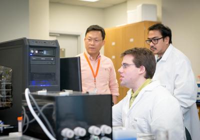 Professor Moo-Yeal Lee, Ph.D. (left), associate professor of the department of chemical and biomedical Engineering at Cleveland State University, at work.