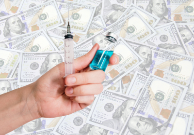 vaccine needle with money background