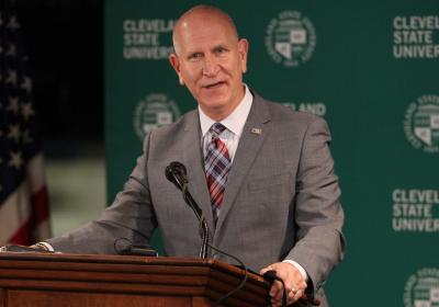 President Sands speaks during the opening of a vaccine clinic on campus