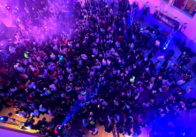 Students dance on the floor of the Student Center Atrium