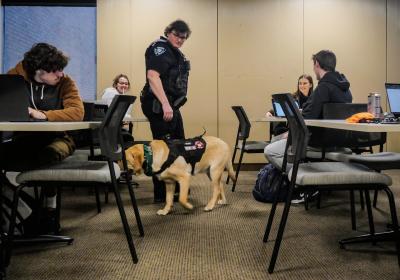 Rune, one of CSU Police Department’s two therapy dogs, and Officer Toni Jones, a Cleveland State police officer and Rune’s handler, visit students at the Science Building on Feb. 16.