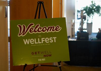 Sign promoting WellFest at the entrance to the event.