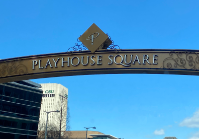 A Playhouse Square banner with CSU's Rhodes Tower in the background.