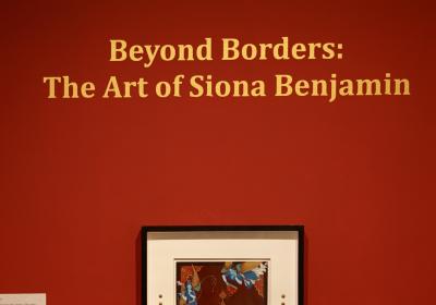 Beyond Borders: The Art of Siona Benjamin on a red wall
