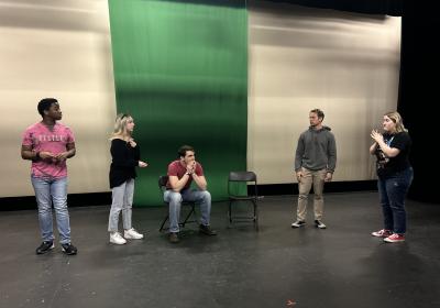Members of the CSU Improv Club acting out a scene