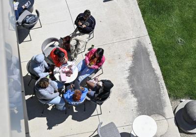 Students sitting together on campus.