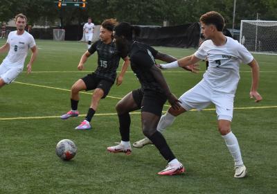  Midfielder RC Schmeider (8), left, rushes over to assist Marko Rimac (7) in taking the ball back from Chicago State. (credit: Alex Martinez).