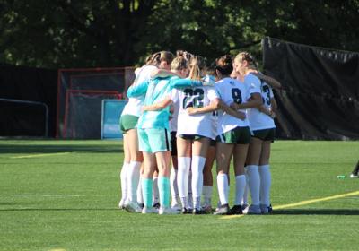 CSU women's soccer in a huddle.