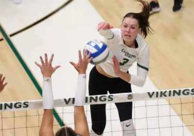 CSU women's volleball player spikes