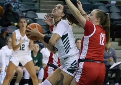 Women's Viking basketball player shoots the ball