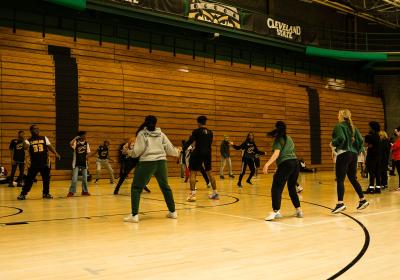 Cavs player leads exercise at event, Feb. 5, 2025.