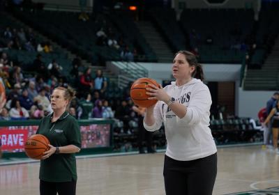 Levin College of Public Affairs and Education Dean Jill Gordon, Ph.D., left, and a CSU student prepare to shoot free throws Feb. 12, 2025.