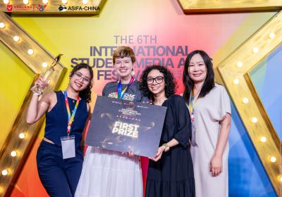Naliyah Dejesus, left, Kara Nottingham, 2nd left, and Julia Whitaker, 2nd right, with Qian Li, professor in the CSU Department of Art and Design, with their 1st prize award at the International Student Media and Arts Festival, Ho Chi Minh City, Vietnam, July 24-30, 2025. 