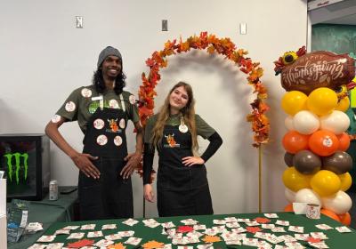 Student volunteers at the entrance of Vikesgiving, handing out “Thankful For You” stickers, Nov. 20, 2025. (credit: Morgan Alten)