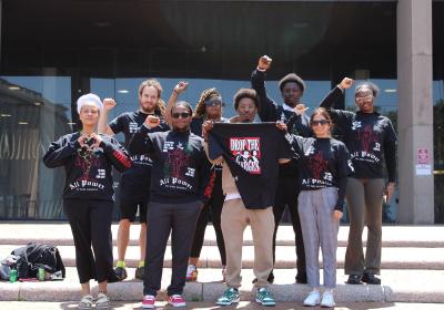New Era Scholars board members along with New Era Cleveland members in front of the Justice Center after trial for The State of Ohio v. Antoine Tolbert on Aug. 1, 2025.