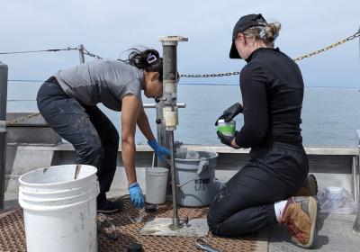 CSU Ph.D. student Anshula Dhiman, left, samples sediments from Lake Erie as part of her investigation into algae.