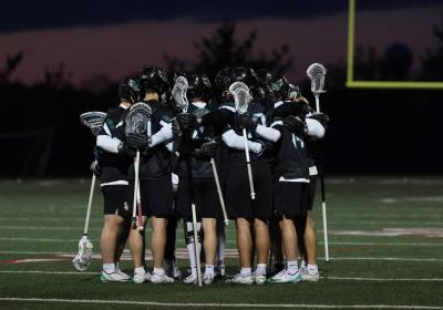 CSU lacrosse in a huddle.