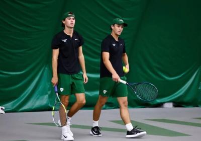 Nico Jamison, left, and Tristan Stine walking onto the tennis court, Sept. 27, 2026.
