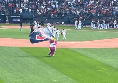 The Guardians' Slider with a flag at Progressive Field.
