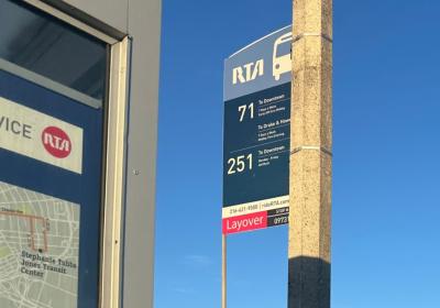 An RTA bus stop sign at the Strongsville park and ride lists routes 71 and 251, both serving downtown Cleveland.