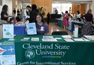 Ruthie Sasso, Education Away graduate assistant, at the fair welcome table on Oct. 6, 2026.